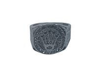 Close-up image of men's silver-tone ring with crown design and dark stones on face