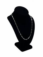 Front view of the sterling silver paperclip rolo chain necklace displayed on black stand showing length and style.