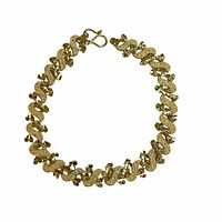 Top view of the gold plated bracelet laid out in circular shape showing textured, interlocking unique links and clasp