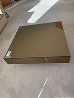 Top view of square mirrored coffee table showing reflective surface and overall dimensions.