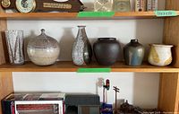 Full shelf view showing all six pottery pieces