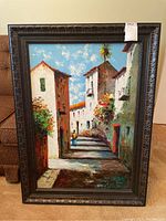 Full front view of the framed painting showing the sunlit street scene with white buildings and palm tree, measuring 39x28 inches.