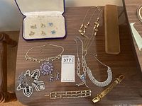 Overview of all jewelry pieces laid out on table