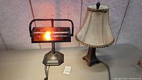 Both table lamps side by side, one working with light on, one off