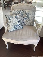 Front view of armchair with cushions