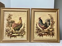 Pair of twin gold colored framed rooster prints side by side showing full front view.