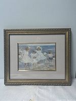 Framed print by Quebec artist Helene Léveillee showing girls at the beach in white clothes, with a gold decorative frame.