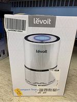Front view of the Levoit air purifier box showing the device image and brand name.