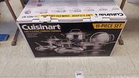 Boxed Cuisinart Chef's Classic stainless steel cookware set showing image of items inside and branding.
