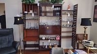 Full assembled view of three-module wall unit in living room setting