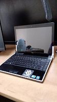 Dell Studio XPS laptop open showing keyboard and screen.
