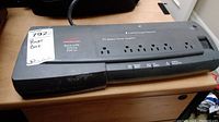 Front and top view of APC Back-UPS Office BF500U unit showing eight outlets and power button.