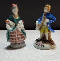 Front view of the two Victorian porcelain figurines showing detailed hand painting and size.