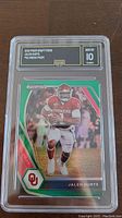 Front view of 2021 Prizm Draft Picks Jalen Hurts Green Prizm rookie card graded Gem Mint 10 by GMA.