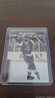 Front of Wayne Gretzky hockey card showing him celebrating in a Los Angeles Kings jersey on the ice.