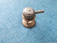 Miniature brass fondue pot with burner base and handle detail