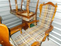 Side view photo showing chair frames and orange/brown plaid seat upholstery, displaying turned wood legs and back details.