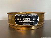 Front view showing label with specifications: U.S.A. Standard Testing Sieve No. 16, 1.18 mm (0.0469 inches), ASTM E-11 specification, Tyler equivalent 14 mesh, made by W.S. Tyler Inc.