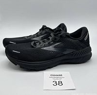 Side and angled view of the black Brooks Adrenaline GTS 22 running shoes, showing profile and design details.