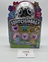 Front view of sealed Hatchimals CollEGGtibles Season 2 1-Pack with pink and purple heart eggs and collectible figures inside clear plastic packaging.