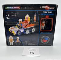 Front of the box showing Laser Pegs Mission Mars Astronaut Transporter 135-piece set with light-up figure and age 7+ recommended.