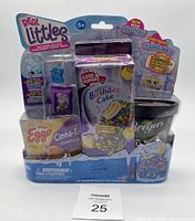 Front view of Shopkins Real Littles shopper pack with three miniature grocery item toys boxed in clear plastic.