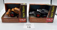 Photo showing two Wild Republic Safari Trek mini trucks with animal figures in original packaging.