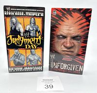 Two WWF VHS tapes featuring Judgment Day and Unforgiven with wrestling imagery, placed side by side.