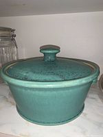 Teal blue pottery with lid and round knob, matte glaze