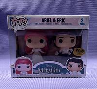 Front view of original boxed Funko Pop 2-pack featuring Ariel and Eric from The Little Mermaid, showing Disney Treasures Exclusive label.