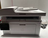 HP LaserJet Pro MFP M126nw printer with closed scanner lid, powered off, front view