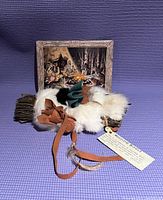 Photo of Native Medicine Bundle placed on purple surface with tag explaining its cultural significance