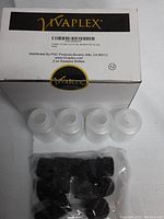 Box labeled Vivaplex containing 2 oz translucent squeeze bottles and separate black caps shown on top of box