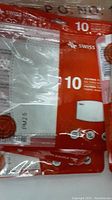 Close-up of red and white packaging showing Swiss Mobility branding, filter type PM2.5, and quantity details.