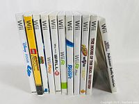 Side view of Nintendo Wii game cases showing all titles.