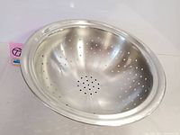 Top-down view showing the polished stainless steel interior with perforations.