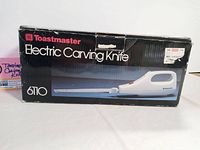 Box showing product branding and model number Toastmaster Electric Carving Knife 6110, front view