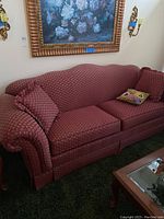 Angle view of the custom BF Bryant sofa showing overall shape, upholstery pattern, and included pillows.