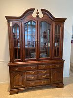 Front view of two-piece wood china cabinet