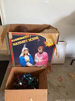 Box labeled 'Illuminated Nativity Scene' with image of three nativity figures.