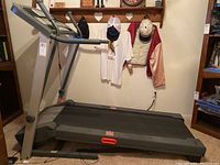 Side view of Pro-Form Crosswalk 480 treadmill showing running belt, handrails, and frame.