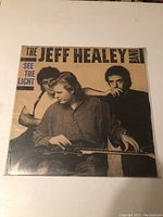 Front cover of The Jeff Healey Band 'See The Light' vinyl album, showing three band members and title text.