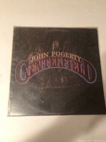 Front cover of the John Fogerty Centerfield vinyl LP showing title and artist name in styled text.