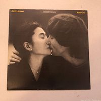 Front cover of Double Fantasy album showing John Lennon and Yoko Ono kissing.