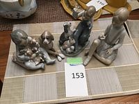 Three figurines arranged on table
