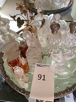 Full collection arranged on scalloped-edge mirrored tray showing all bottles and diffuser