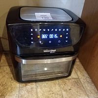 Front view of the Wow Chef digital air fryer with illuminated touchscreen showing temperature and timer.