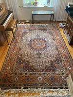Overall top-down view of full rug in room showing pattern, size and surrounding furniture
