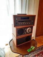 Three-module stack: Model CD on top, Model Two radio in middle, passive speaker on bottom, remote on top