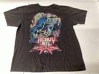 Front view of black t-shirt with colorful Heavy MTL Montreal 2011 graphic.